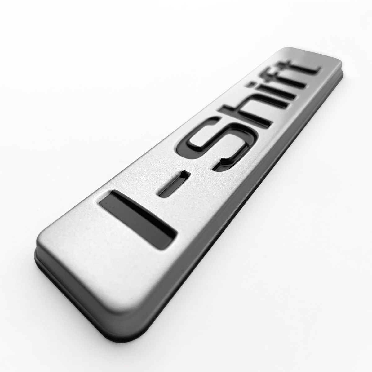 EMBLEMA ADES. CROMADO LOGO I.SHIFT PLAQUETA