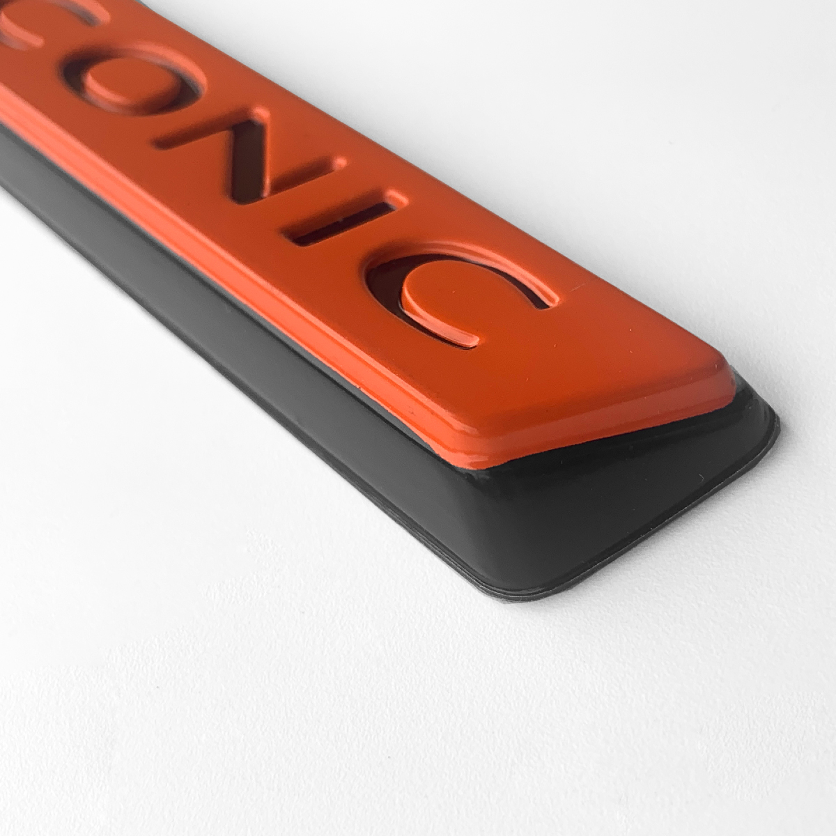 EMBLEMA CROMADO DA GRADE   DUSTER 23/24 